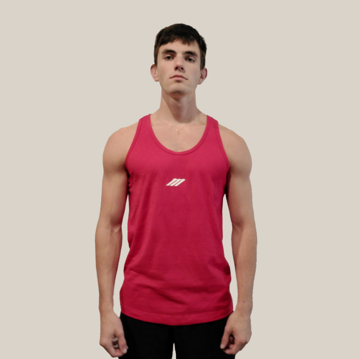 Person wearing a red tank top with a Motion M logo on a beige background
