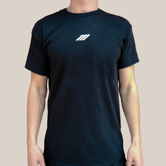 Black t-shirt with a white Motion M logo on a beige background