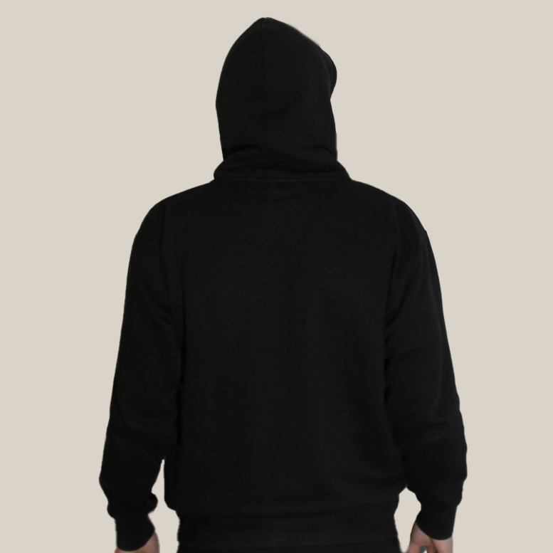 Person wearing a black hoodie on a beige background - Motion logo on back neckline
